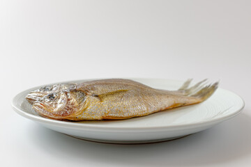 dried yellow croaker on a white background