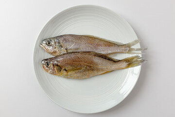 dried yellow croaker on a white background