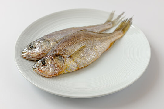 dried yellow croaker on a white background