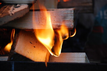 The fire blazes between the firewood stacked durgas on top of each other. Several pine and birch...
