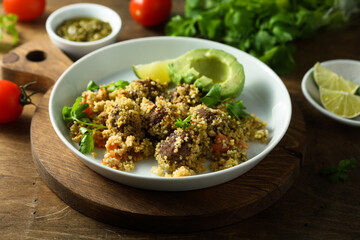 Meatballs with couscous and avocado