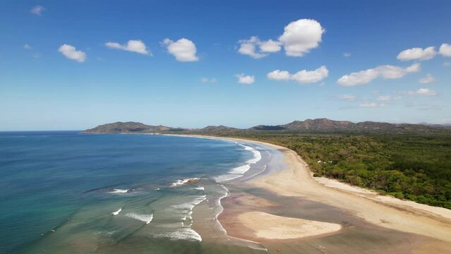 Extensive and vast beach of the Tamarindo coastline area on sunny day, Costa Rica