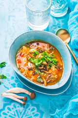 Thai chicken red curry. Thailand tradition red curry soup with chicken, mushrooms and coconut milk.