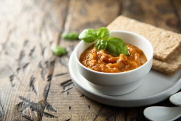 Homemade roasted vegetables dip with fresh basil