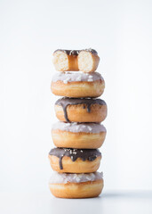 Donuts with dark and white chocolate on a white background