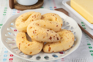 Chipas, typical south american cheese bun on a plate with butter