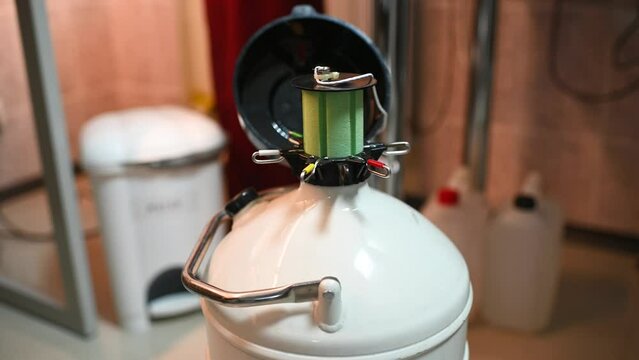 Dewar vessel with liquid nitrogen with frozen embryos and eggs in a cryobank in a modern IVF clinic. Reproductive medicine, in vitro fertilization