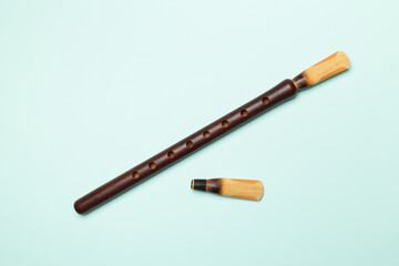 Armenian national musical instrument duduk on color background. Top view