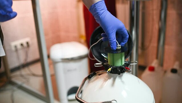 Dewar vessel with liquid nitrogen with frozen embryos and eggs in a cryobank in a modern IVF clinic. Reproductive medicine, in vitro fertilization