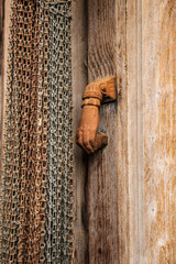 Old wooden door and vintage knocker