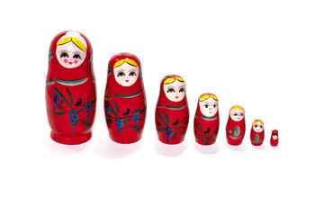 Fototapeta na wymiar Red colored nesting dolls on a white background. Matryoshka.