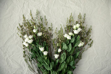 Flower arrangment on crumpled paper.