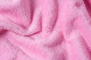 Fototapeta na wymiar pink fluffy plaid background with folds