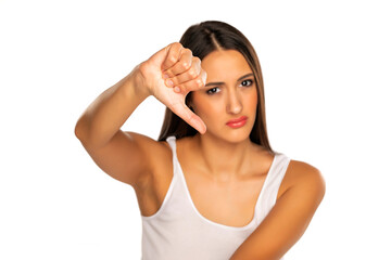 Angry woman doing dislike thumb down gesture