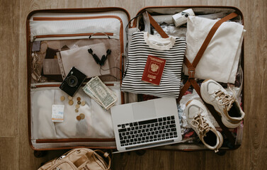 open suitcase with clothes and things