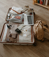 open suitcase with clothes and things