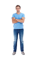 Playing it cool. Full length shot of a young man in a studio with his arms crossed.