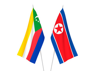 National fabric flags of Union of the Comoros and North Korea isolated on white background. 3d rendering illustration.