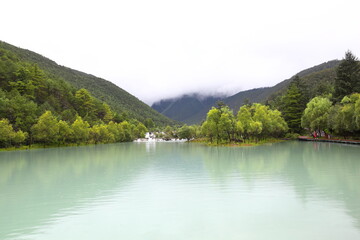 Fototapeta na wymiar Baishui River in Yulong Naxi Autonomous County, Lijiang City, Yunnan Province, also known as Blue Moon Valley