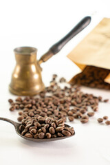 Top view of three different varieties of coffee beans on light white background