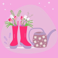 watering can and boots with flowers