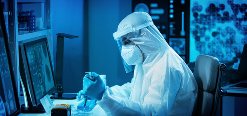 Scientist works in a modern scientific lab using laboratory equipment, microscope and computer...