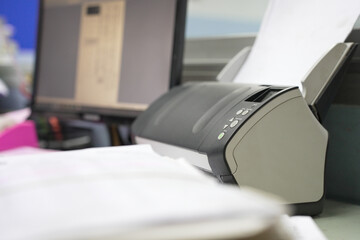 Using scanner machine for convert document to digital data storing into computer, Stacks of paper, piles of unfinished documents, Business report papers.