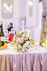 A beautiful wedding bouquet is on the festive table