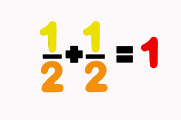 One-two fractions plus one-two fractions equals One isolated on white background. Number are made of multi color wood. Simple math addition operation for kid. Plus, minus, multiply, divide.
