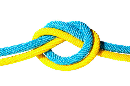 Blue and yellow cords knotted together isolated
