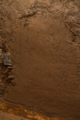 Building a House with Straw Clay -  mixing ingredients on the building site. Ancient techniques of traditional architecture.