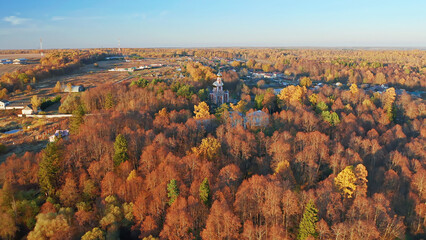 Autumn forest, Christian temple, beautiful nature shots from a drone, sunset, beauty of Russia, Buryatino village, aerial view