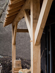 Traditional joinery in wooden architecture -  skilled carpenter work -  connected beam and post in the barn style building.