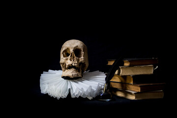 Books with a quill, inkwell, skull and ruff. world literature concept