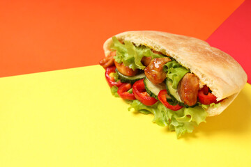 Pita with chicken meat on three tone background