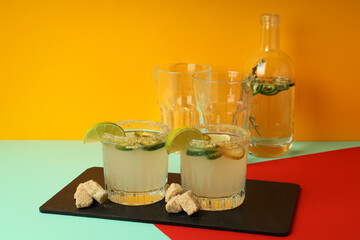 Concept of drink with Jalapeno cocktail on multicolor background