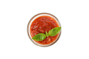 Adjika with basil leaves isolated on white background