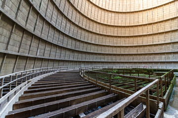 Inside a cooling tower of a nuclear power plant. Green overgrown.