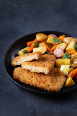 Vegan Plant based fish with crispy batter and roasted vegetables