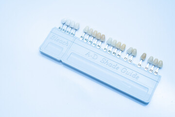 Bleach shade guide for comparing teeth shades. Dental tools