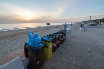 Garbage containers on the Matalascañas promenade. Cleaning concept.