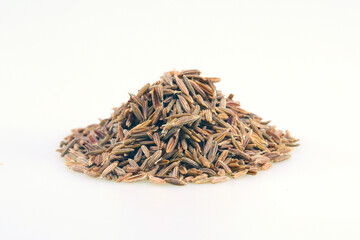 A small pile of Cumin seed isolated on white
