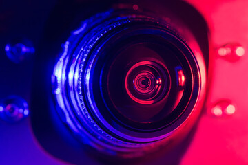 Camera lens with purple and red backlight. Optics. Cyberpunk style