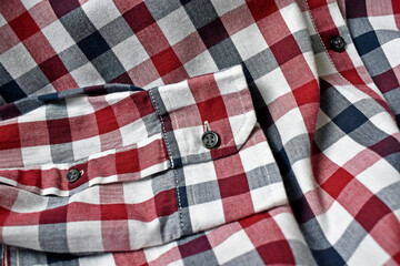 Fototapeta na wymiar Men's plaid shirt in navy blue, red and white