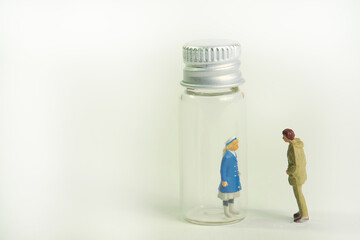a young woman locked in a glass bottle