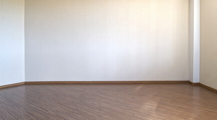 Clean white interior without furniture. Beige wall and brown wood texture floor.
