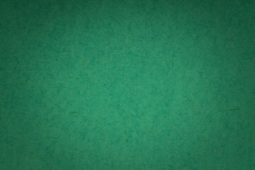 dark vivid green jeans uneven texture background