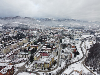 An aerial shot of the cityscape view of Sarajevo covered with the snow in Bosnia and Herzegovina