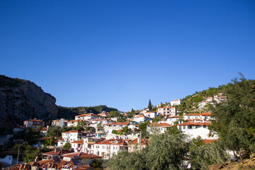 Fototapeta premium Muğla houses on the mountain slope in Turkey