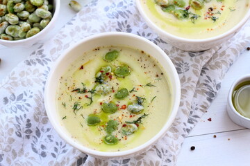 Kohlrabi cream soup with fried broad beans. A healthy vegetarian meal